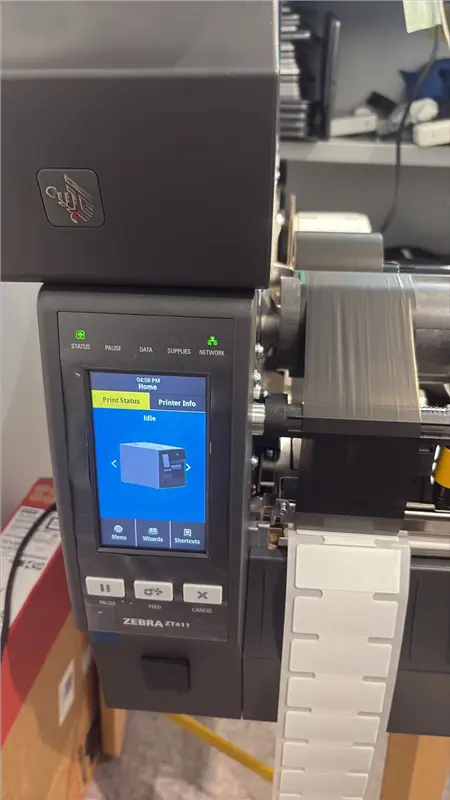 Zebra ZT411 — Print Status screen, Idle, RFID labels visible in output slot